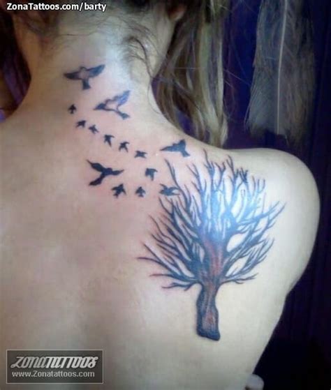 Tattoo Of Birds Trees Shoulder Blade