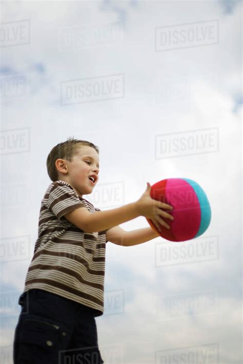 Little Boy Catching Ball Stock Photo Dissolve