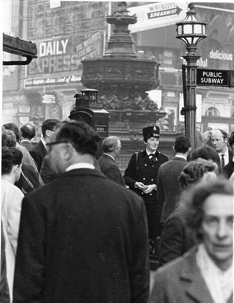 Woman Police Officer At Piccadilly Circus London Available As Framed