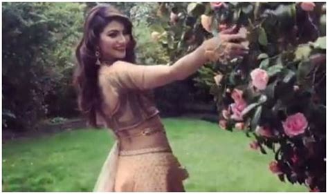 urvashi rautela looks sizzling hot as she flaunts her waistline in garden sensuous video breaks