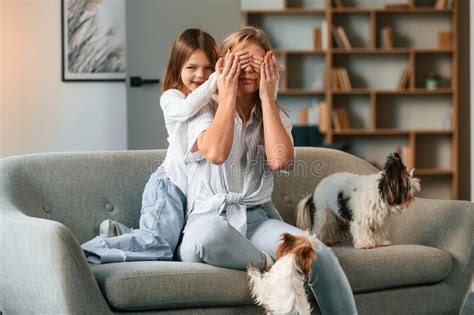 Girl Is Covering Woman S Eyes By Hands Surprise Mother With Her