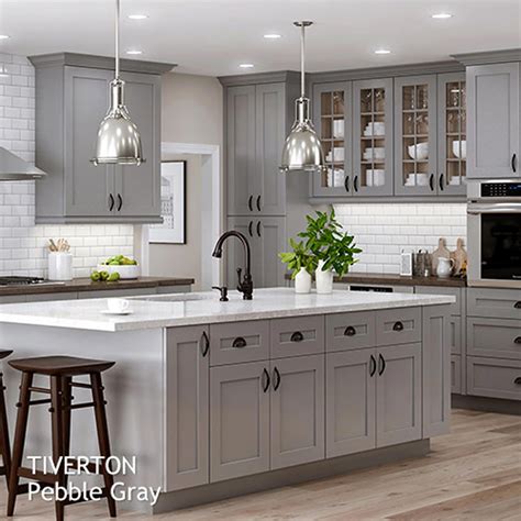 Gray kitchen cabinets can be a great focal point in a room, and are a unique alternative to traditional white cabinets and other neutral choices . Backsplash Light grey Shaker style kitchen cabinet painted ...