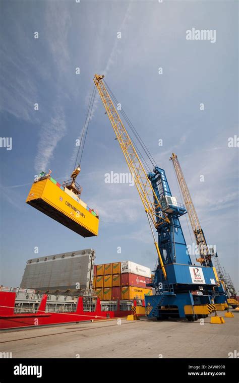 Dock Crane Loading And Unloading A Container From A Container Ship