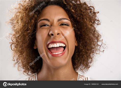 Laughing African American Woman Stock Photo By ©ikostudio 168582122