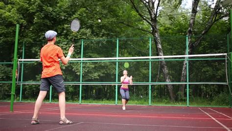 The length of kids badminton rackets usually ranges from 21 inches to 23 inches and weight. Boy Girl Playing Badminton In Yard Against House Wall ...