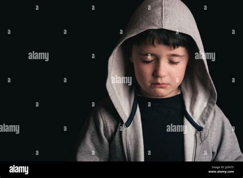 Sad Boy On Black Background Stock Photo Alamy