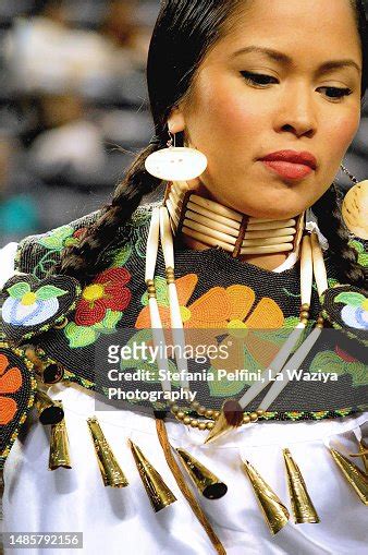 A Beautiful Native American Woman Dances At The Dance For Mother Earth Powwow High Res Stock