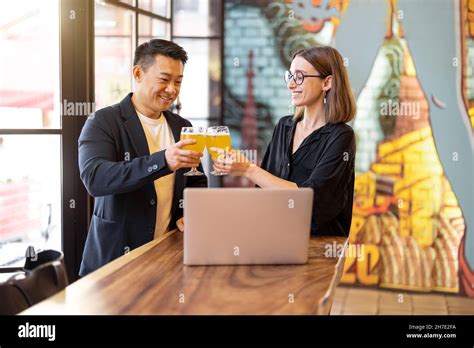 Friends Talk And Drink Beer In Bar Stock Photo Alamy