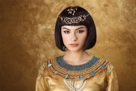 Beautiful Woman With Fashion Make Up And Hairstyle Like Egyptian Queen Cleopatra Outdoors