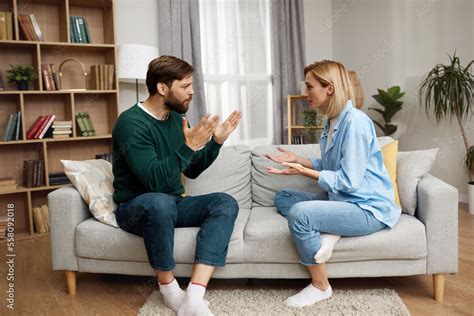 Couple Having Argument At Home Angry Wife Shouting At Husband Of Problem Frustrated Husband