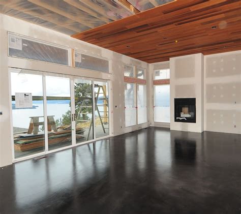 A Modern Black Stained Concrete Floor Created By Mode Concrete In