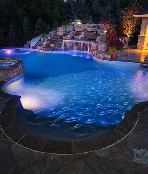 A small body of still water. 50 In-Ground Swimming Pool Lighting Ideas and Colors