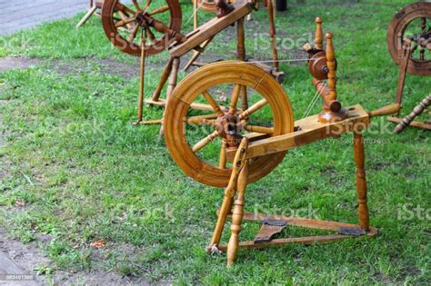 Maybe you would like to learn more about one of these? Old Spinning Wheel Stock Photo - Download Image Now - iStock