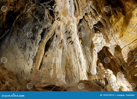 Stalactite And Stalagmite Formations On The Rocky Walls Of A Large