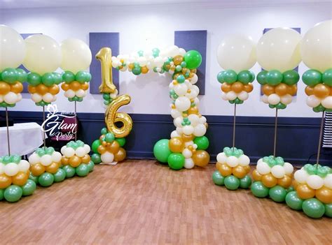 Green And Gold Organic Balloon Arch And Balloon Columns For A Sweet 16