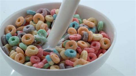 Milk Pouring Into Bowl Of Cereal In Slow Motion Stock Video Footage