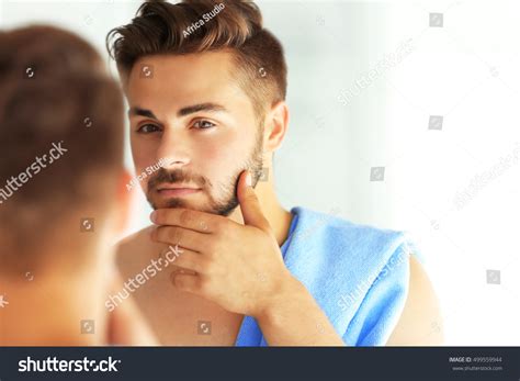 Handsome Unshaven Man Looking Mirror Stock Photo 499559944 Shutterstock