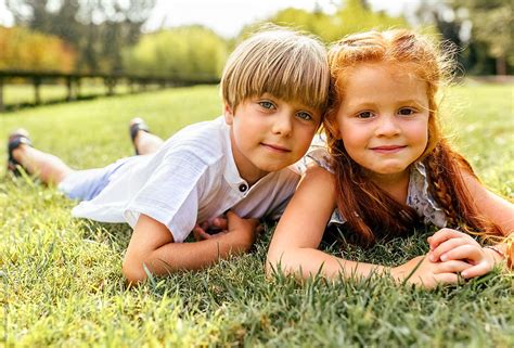 portrait of a little brother and sister in the park by stocksy contributor marco govel stocksy