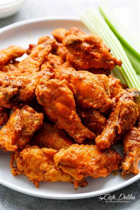 Using a slotted spoon, return the wings to the baking sheet, leaving extra sauce behind. Crispy Buffalo Chicken Wings (BAKED) - Cafe Delites