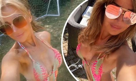 Lizzie Cundy Bares Almost All In A Very Racy Hot Pink Swimsuit For A