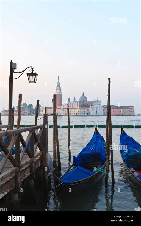 Gondolas Moored On The Lagoon San Giorgio Maggiore Beyond Riva Degli