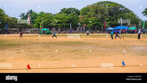 Sri Lankan People Playing Cricket In Front Of The Dutch Fort Negombo