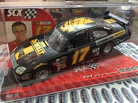 We carry all the major brands with cars and the parts to support your hobby or relive those nostalgic moments from the past. SCX 63390 Ford Fusion De Walt Kenseth Nascar 1/32 Slot Car.