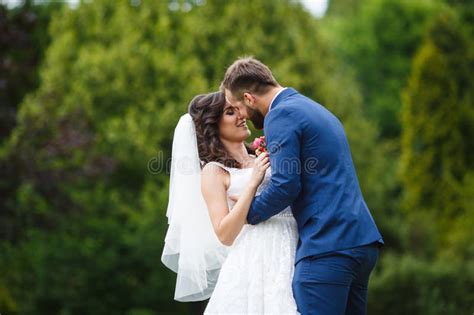 Happy Newlywed Couple Smiling Hugging Park Field Surround Stock Photos