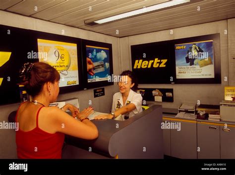 Tourist Renting A Car Woman Agent Hertz Hertz Car Rental Hertz Car