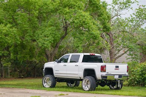 White Lifted Gmc Pick Up Truck With Big Rims Tires Editorial Image