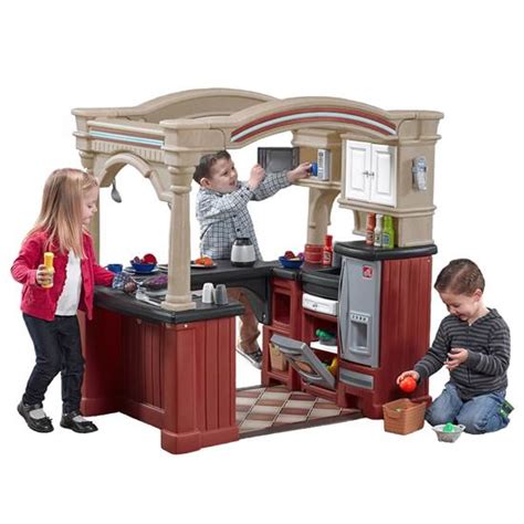Step2 deluxe kitchen, like new $120 price firm included all original accesories when u put the original pot and pan the burn makes realistic sound batteries included toy step 2 kitchen for sale kitchen comes with you foods toy utensils and the toy kitchen and comes with toy microwave and toaster. Grand Walk-In Kitchen | Kids Play Kitchen | Step2