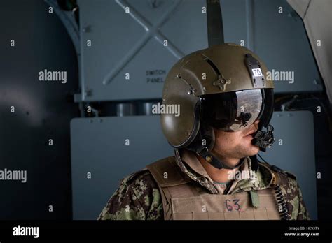 An Afghan Air Force Aaf Aerial Gunner Scans For Threats In An Mi 17