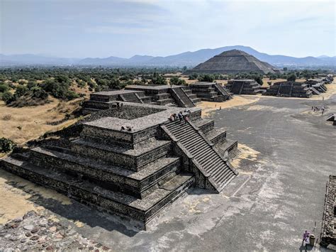 An Aerial View Of The Pyramids At Tempelum In Mexico With Mountains In