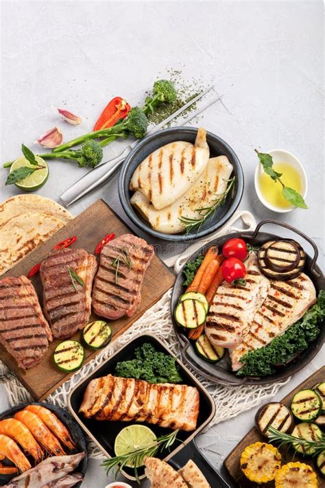 Grilled Fish Seafood And Meat Assortment On Light Background Stock