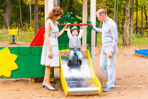 Playful Child With Parents At The Stock Image Colourbox