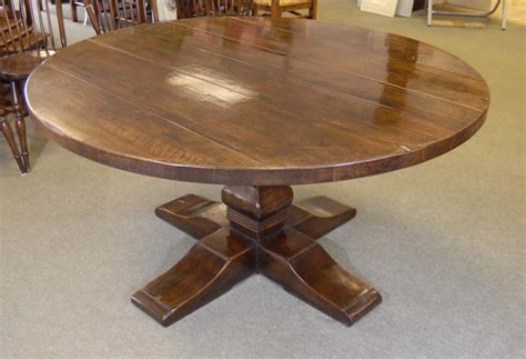 Featuring a classic design with a turned pedestal base, the round dining table can easily pair with decor ranging from farmhouse to traditional. Round Spanish Refectory Farmhouse Table Oak Tables Diners