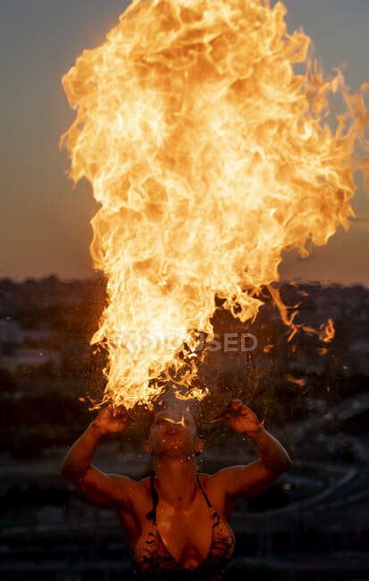 Fire Eater Woman Performing Spit Fire At Sunset — Fair Weather Dusk