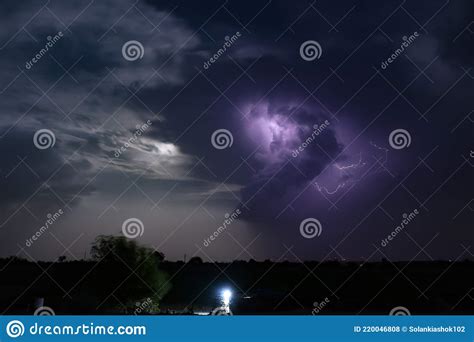 Dramatic Night Cloudscape With Thunderbolt Lightning And Moon Light