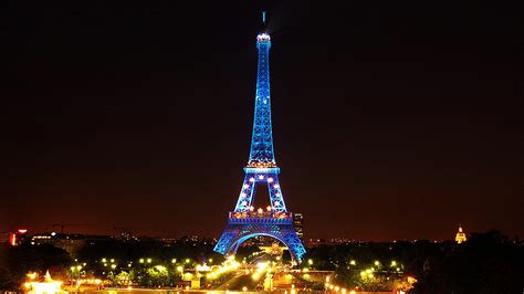 Blue Lighting Paris Eiffel Tower With Background Of Black Sky During