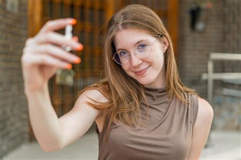 Premium Photo Young French Girl With Glasses At Outdoors Holding Home