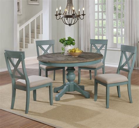You can also buy a table with wheels and use it for different purposes. Prato 5-Piece Round Dining Table Set with Cross Back ...