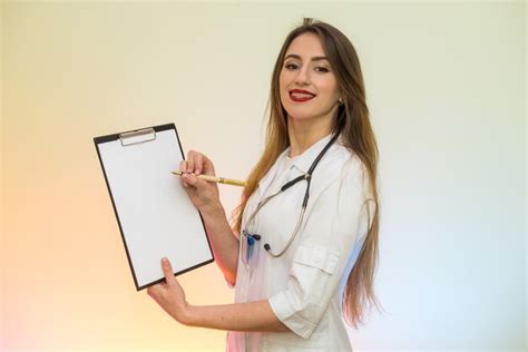 Premium Photo Doctor Holding Clipboard With Pen Pretty Woman In