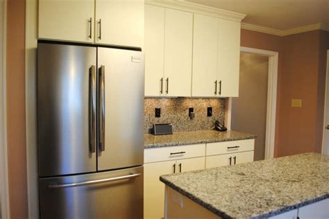 The cabinets are manufactured from. White "Rohe" Cabinets, Stainless Appliances - Kitchen ...
