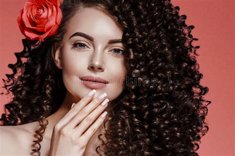 Beauty Woman With Rose Flower Beautiful Curly Hair And Lips Stock Photo