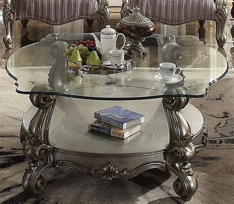 Actually, this is a piece that has a durable hardwood structure, a glass top and leather covering. Versailles Traditional Antique Platinum Glass Top Coffee ...