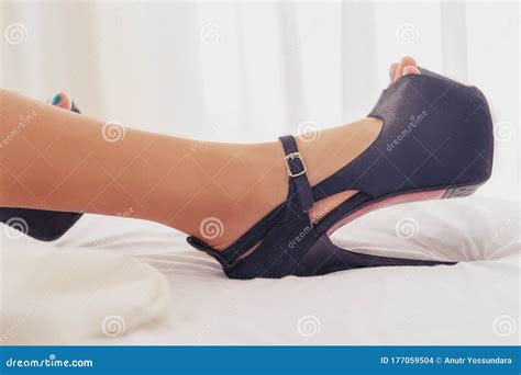 Woman Leg High Heels On Bed For Sensuality And Seductive Concept Stock