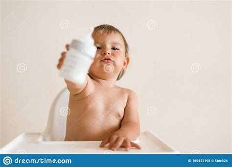 Adorable Baby Drinking Milk From A Bottle From Bottle Formula Drink