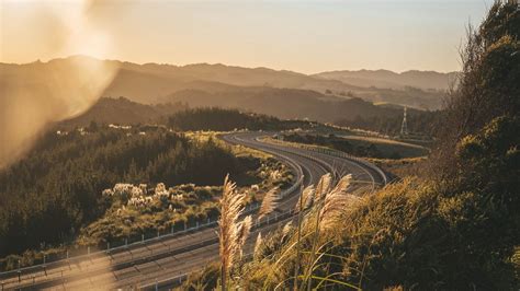 Download Wallpaper 1600x900 Road Turn Grass Sky Landscape