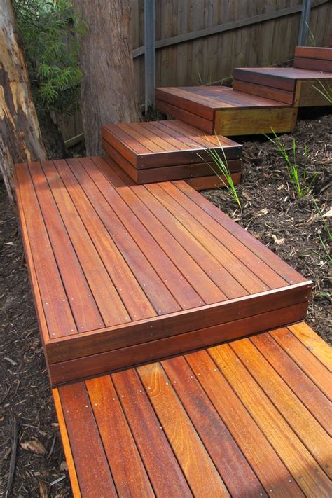 A Wooden Deck With Steps Leading Up To It