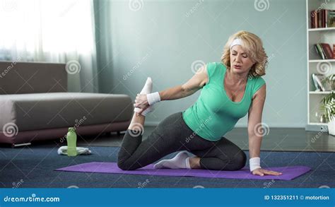 Tired Mature Woman Doing Yoga Exercises Stretching Legs Healthy Lifestyle Stock Image Image